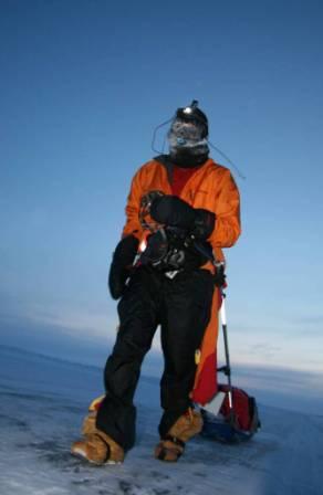 Chris walking along the "ice road" approaching the Arctic Ocean